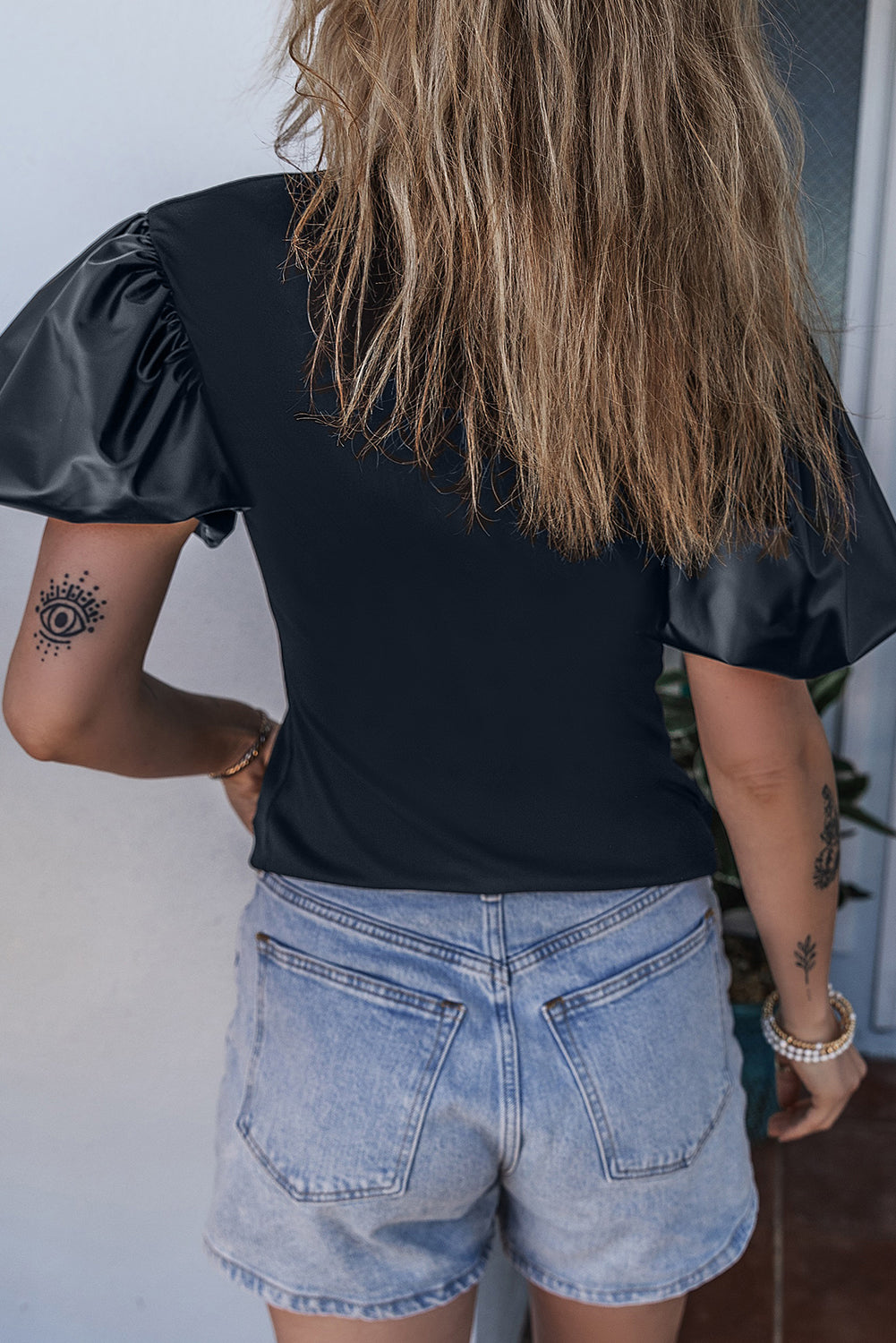 Top  .  Black Faux Leather Puff Short Sleeve Mock Neck Top