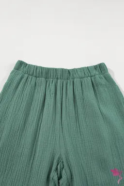 Pants  .  Green Textured High Waist Ruffled Bell Bottom Pants.